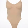 Bloch Seamless Thong Bodysuit 2 Bloch Seamless Thong Bodysuit -Dance Costumes bl l3147nud bloch seamless thong bodysuit tan front 96465.1678925951
